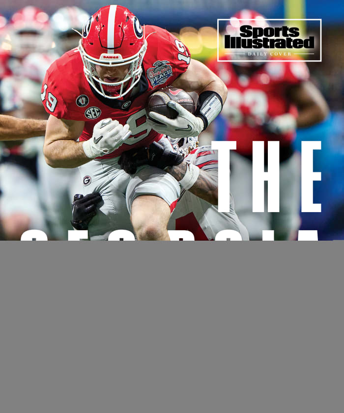 Georgia’s Brock Bowers barrels through the Ohio State defense.